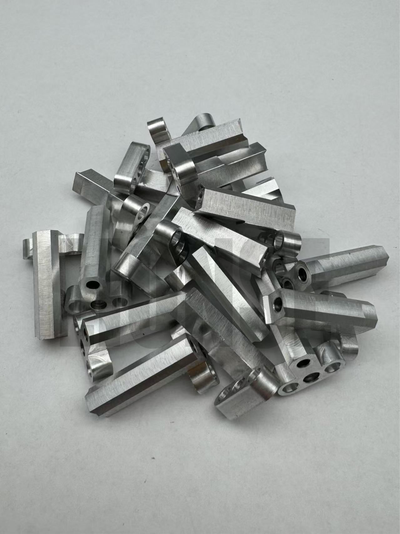 Small Precision Machined Perforated Metal Connecting Bracket